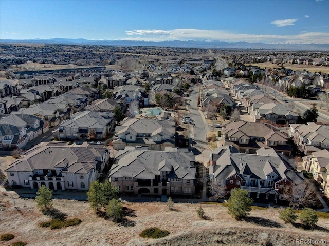 birds eye view of property with a mountain view