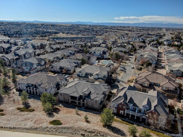 birds eye view of property with a mountain view