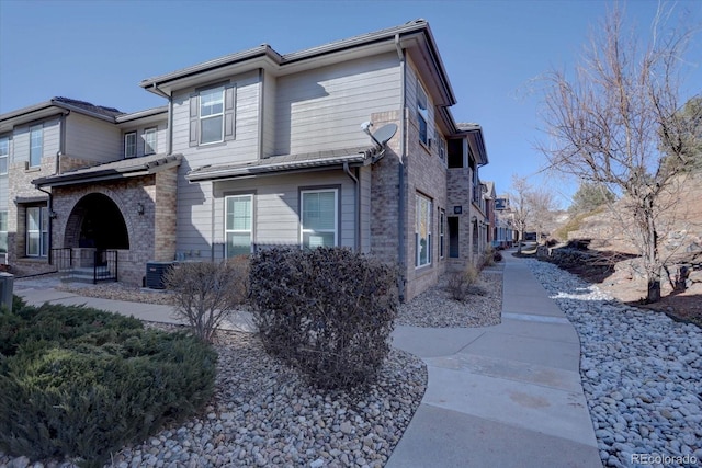 view of side of home with cooling unit