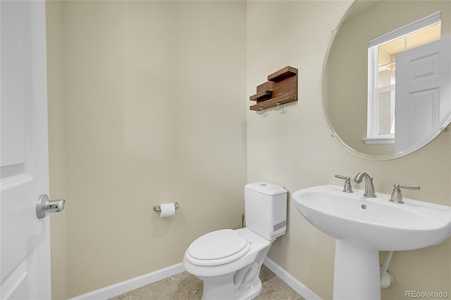 bathroom featuring tile patterned floors and toilet