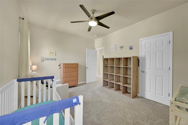 carpeted bedroom with ceiling fan