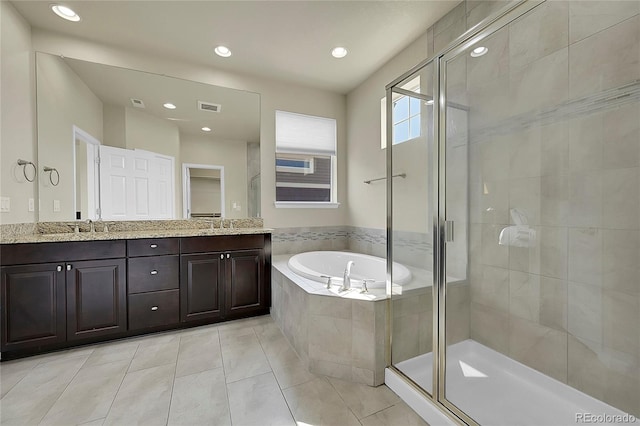 bathroom with plus walk in shower, tile patterned flooring, and dual bowl vanity