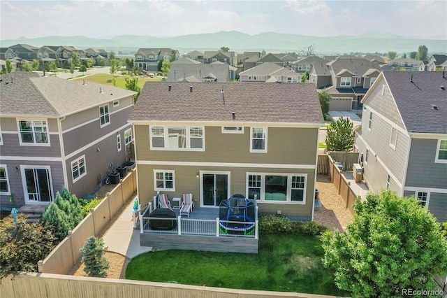 back of house featuring a deck with mountain view