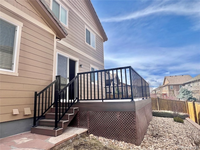 wooden deck with fence and a residential view