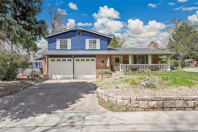 view of front of home with fence, an attached garage, brick siding, a porch, and driveway