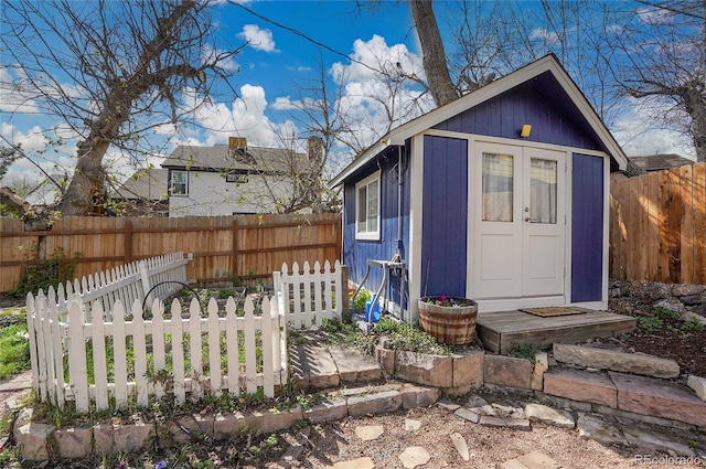 view of shed with a fenced backyard