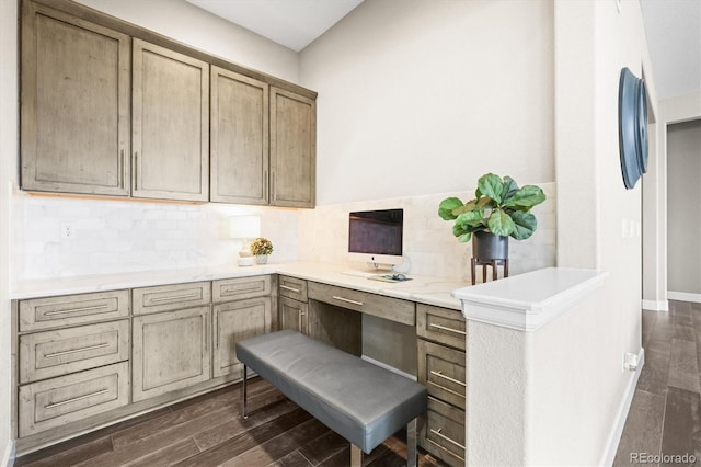 office featuring dark wood-type flooring, baseboards, and built in study area