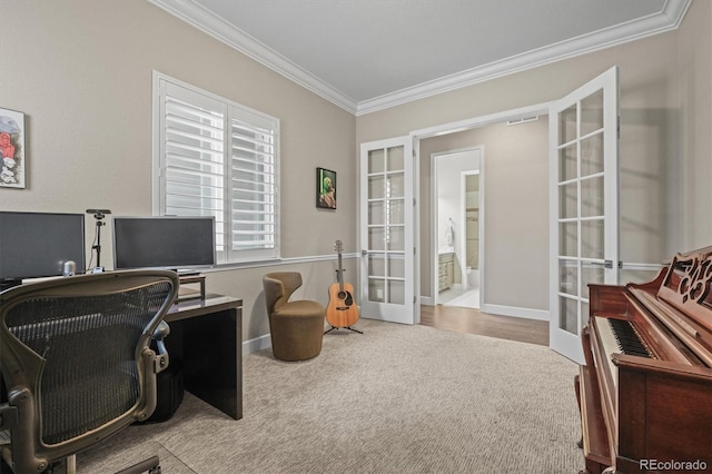 carpeted office space featuring french doors, ornamental molding, and baseboards