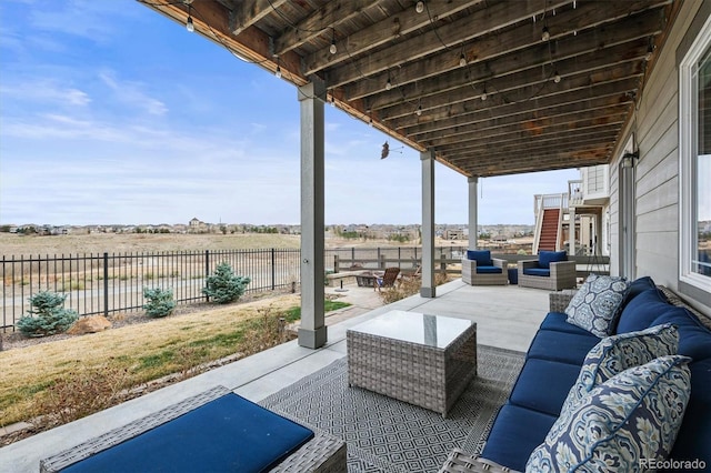 view of patio / terrace featuring an outdoor hangout area and a fenced backyard