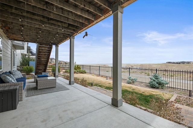 view of patio featuring a fenced backyard and stairway