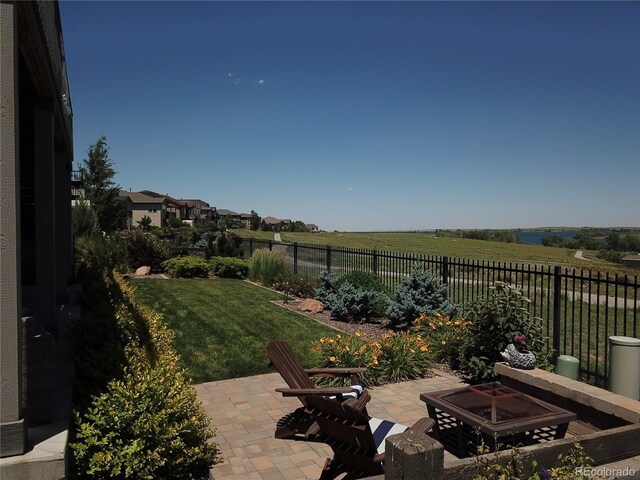 26741 E Peakview Pl, Aurora, CO 80016 - fenced backyard with a patio and an outdoor fire pit
