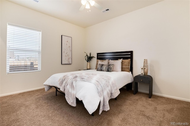 bedroom with ceiling fan, carpet, visible vents, and baseboards