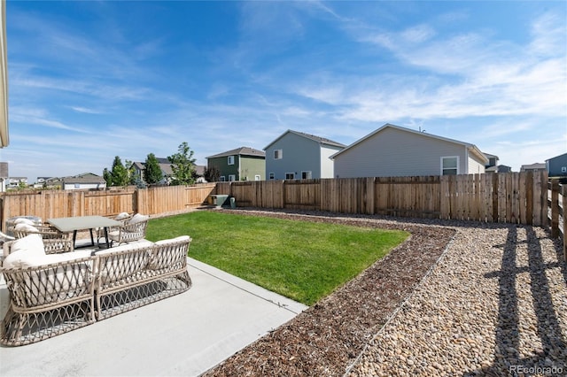 view of yard featuring a patio, a fenced backyard, and a residential view