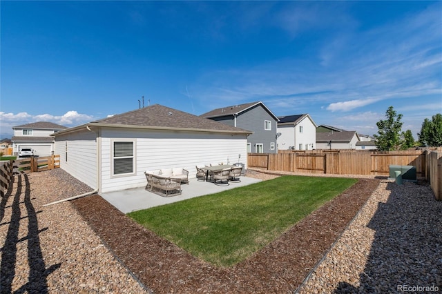 rear view of house with a patio, a lawn, a fenced backyard, and roof with shingles