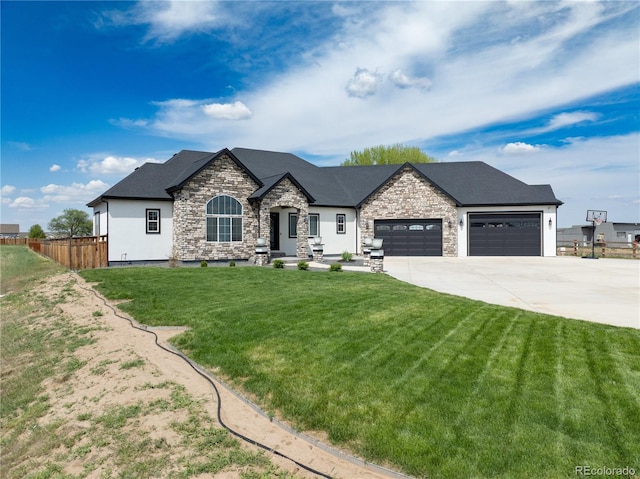 french country inspired facade with a garage, concrete driveway, and stone siding