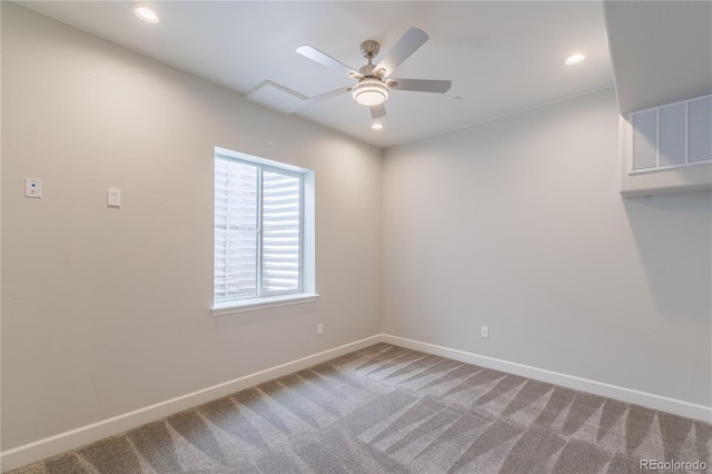 carpeted empty room featuring a ceiling fan, baseboards, and recessed lighting