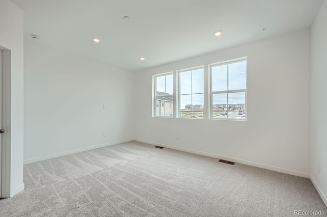 700 N Bently St, Watkins, CO 80137 - empty room with baseboards, carpet, and recessed lighting
