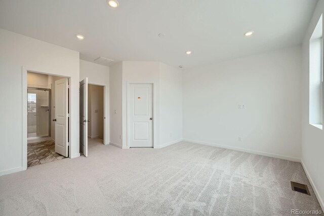 700 N Bently St, Watkins, CO 80137 - unfurnished bedroom featuring light colored carpet, recessed lighting, baseboards, and ensuite bathroom