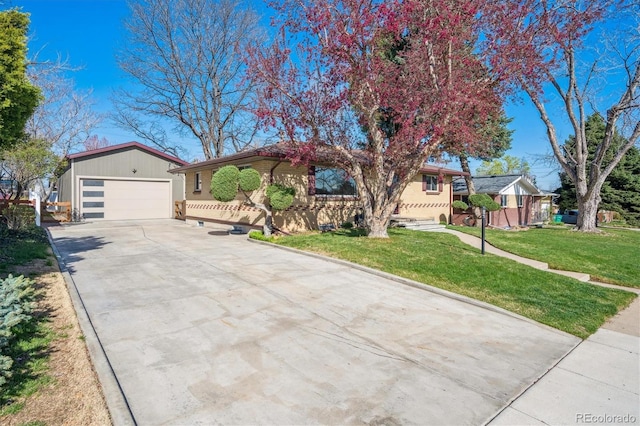 single story home with driveway and a front yard