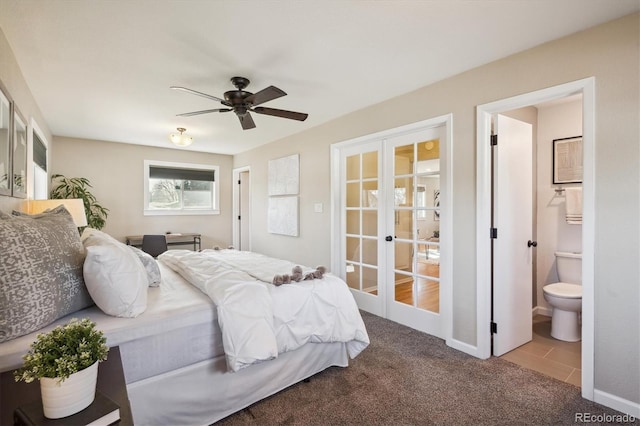 bedroom featuring carpet, french doors, ensuite bath, and a ceiling fan