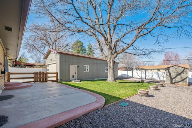 view of yard with visible vents, fence, and an outdoor structure