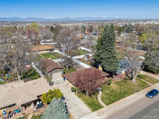 birds eye view of property with a mountain view and a residential view