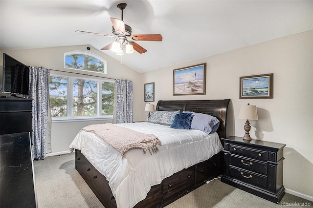 bedroom featuring vaulted ceiling, light colored carpet, and ceiling fan