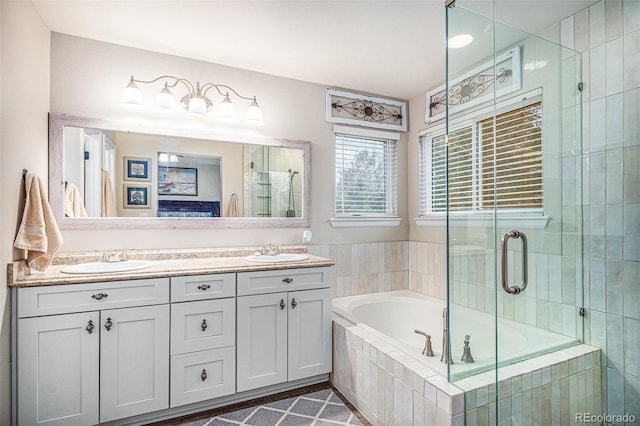 bathroom with vanity and plus walk in shower