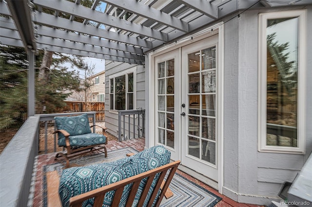 wooden deck with french doors and a pergola