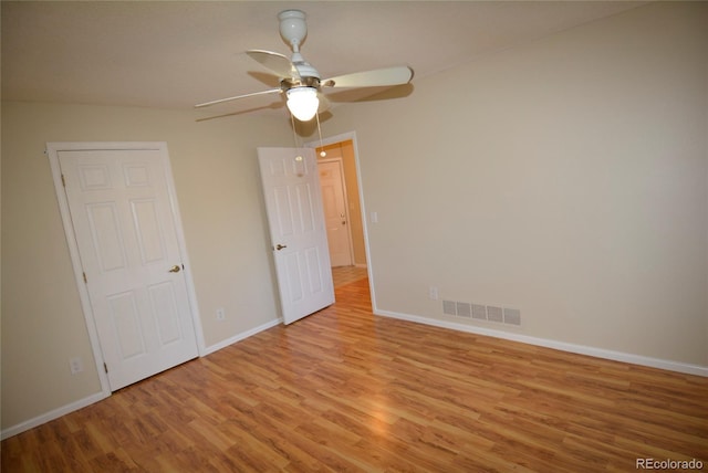 unfurnished bedroom featuring ceiling fan and light wood-type flooring