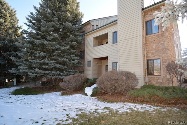 view of snow covered property