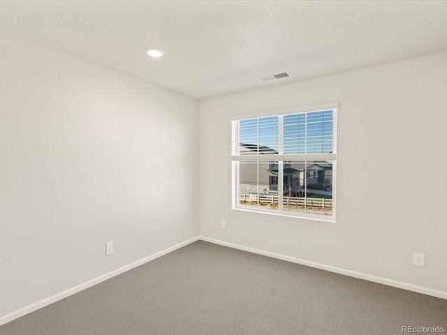 unfurnished room featuring carpet flooring