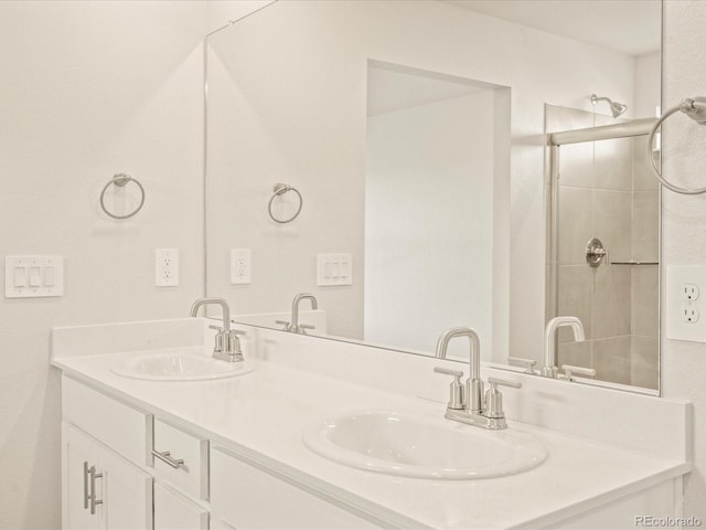 bathroom with vanity and a tile shower