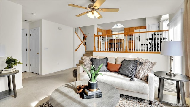 living room with light carpet and ceiling fan