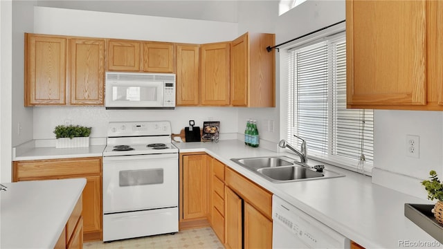 kitchen with sink and white appliances