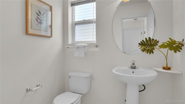 bathroom with toilet and sink