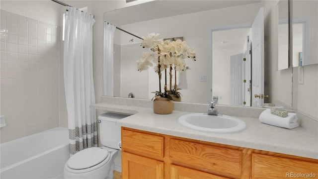 full bathroom with shower / bath combo, vanity, and toilet