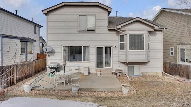 rear view of property featuring a patio area