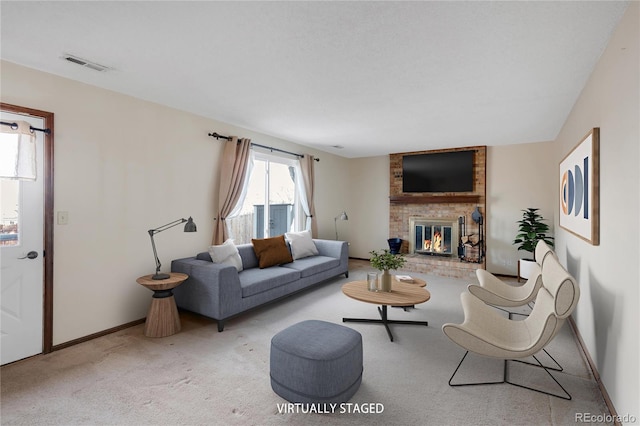 carpeted living area with visible vents, a fireplace, and baseboards