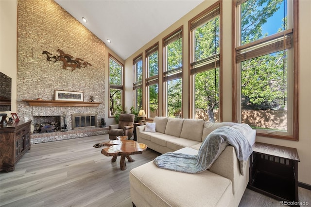 sunroom / solarium with healthy amount of natural light and vaulted ceiling