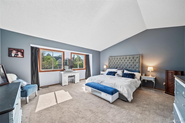 bedroom featuring a textured ceiling, vaulted ceiling, carpet floors, and baseboards