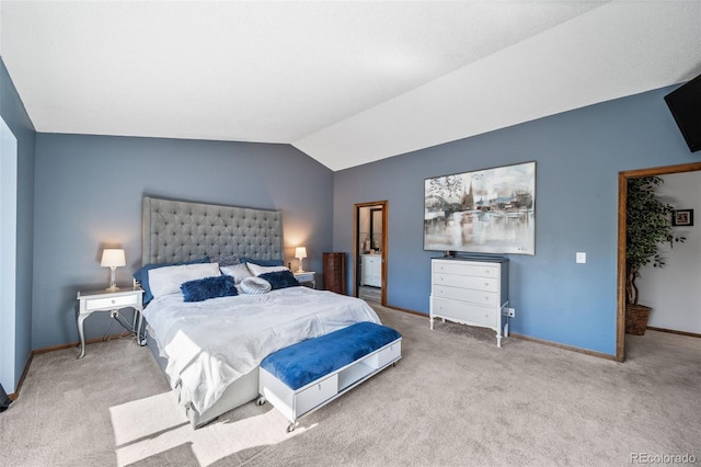 carpeted bedroom featuring lofted ceiling and baseboards