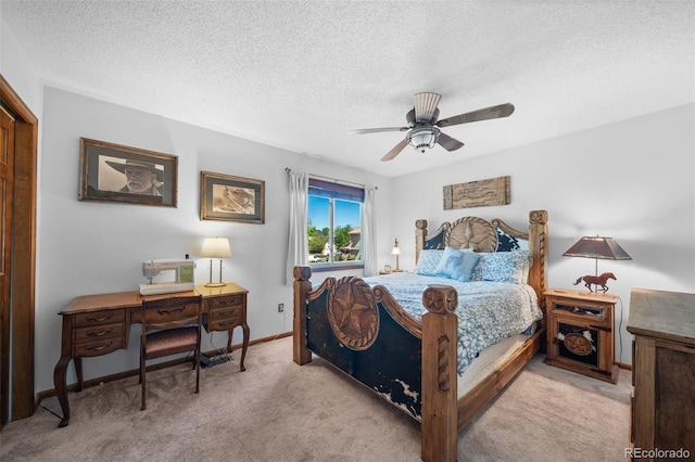 bedroom with carpet floors, a textured ceiling, ceiling fan, baseboards, and a closet