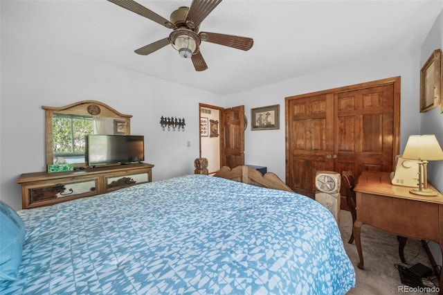 bedroom with carpet flooring, a ceiling fan, and a closet
