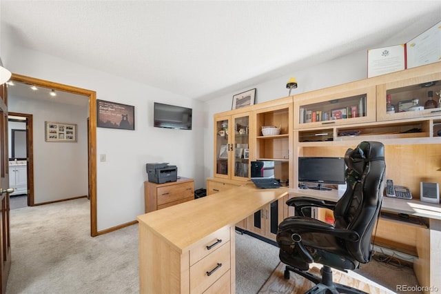 office space featuring light colored carpet and baseboards