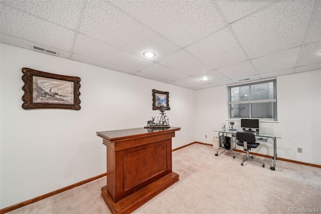 office space with light colored carpet, baseboards, a drop ceiling, and recessed lighting