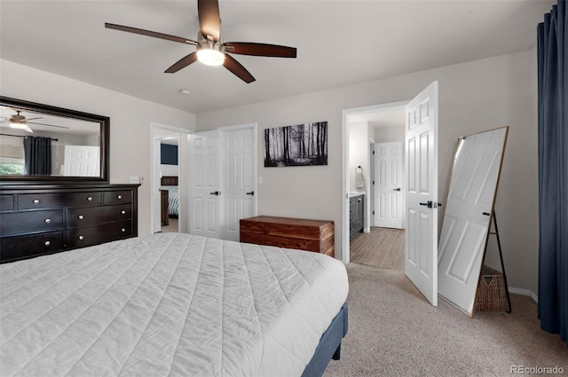 carpeted bedroom featuring a ceiling fan and connected bathroom