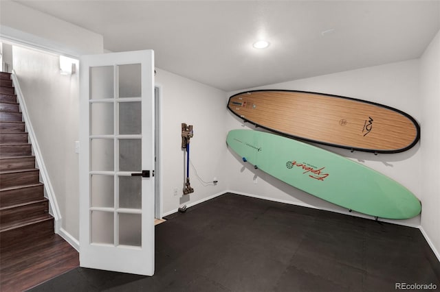 interior space featuring recessed lighting, baseboards, vaulted ceiling, and stairs