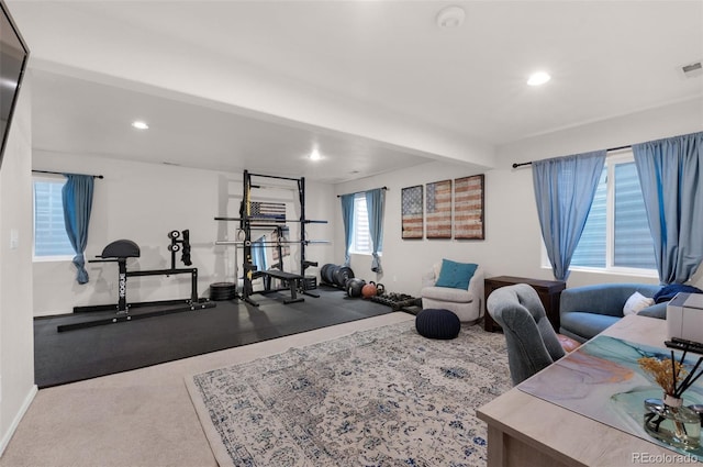 exercise area with baseboards, visible vents, and recessed lighting