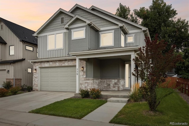 view of front of home featuring a porch and a garage